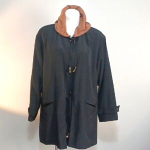 Medium black raincoat jacket.  Hooded rain coat w/ button close. Outdoor Walking